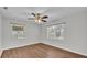 Bright bedroom features wood-look floors, ceiling fan and two windows to allow for plenty of natural light at 747 E Bella Vista St, Lakeland, FL 33805