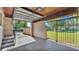 Spacious garage with concrete floor and a view of the backyard featuring a grassy area and fencing at 747 E Bella Vista St, Lakeland, FL 33805