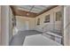 Spacious garage area with ample storage, access to the backyard, and a secure gate at 747 E Bella Vista St, Lakeland, FL 33805