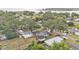 Home with a detached garage situated among mature trees near the coast at 828 E Valencia St, Lakeland, FL 33805