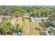 Aerial view of the neighborhood showcasing the property's position amongst lush greenery and nearby homes at 828 E Valencia St, Lakeland, FL 33805