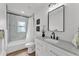 Updated bathroom featuring modern vanity, sleek fixtures, and shower with modern tile and black trim at 828 E Valencia St, Lakeland, FL 33805