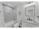 Bright bathroom featuring marble-style tile, sleek vanity, and modern fixtures, all freshly updated at 828 E Valencia St, Lakeland, FL 33805