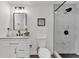 Modern bathroom features updated vanity, fixtures, and tiled walk-in shower at 828 E Valencia St, Lakeland, FL 33805