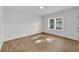 Bright bedroom with light wood floors, white walls, a window and modern trim at 828 E Valencia St, Lakeland, FL 33805