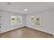 This bedroom features wood-look floors, neutral colors, and bright natural light at 828 E Valencia St, Lakeland, FL 33805