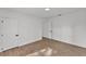 Spacious bedroom with light wood floors, white walls, and modern trim at 828 E Valencia St, Lakeland, FL 33805