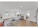 Bright bedroom features wood-look floors, a comfortable bed and a connecting door to the office at 828 E Valencia St, Lakeland, FL 33805