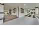 Exterior view of a home featuring an attached carport, a covered porch, and a detached garage at 828 E Valencia St, Lakeland, FL 33805