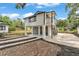 Unique home design with stilt-style construction, modern finishes, and meticulous landscaping at 828 E Valencia St, Lakeland, FL 33805