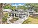 Charming home features a classic design with a welcoming front porch and a detached garage at 828 E Valencia St, Lakeland, FL 33805