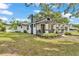 Charming home with a covered front porch and well-maintained landscaping at 828 E Valencia St, Lakeland, FL 33805