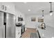Modern kitchen featuring stainless steel appliances, white cabinets, and an island with seating at 828 E Valencia St, Lakeland, FL 33805