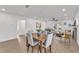 Open-concept living space featuring modern furnishings, wood floors, and lots of natural light at 828 E Valencia St, Lakeland, FL 33805