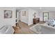 Interior view showcasing a modern living space that flows into the dining area, featuring wood floors at 828 E Valencia St, Lakeland, FL 33805