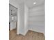 Walk-in pantry with shelving for organized storage, located adjacent to the kitchen at 828 E Valencia St, Lakeland, FL 33805