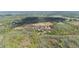 Property boundaries highlighted in red, showing acreage with trees, open land, offering multiple possibilities at 8337 Fussell Rd, Polk City, FL 33868