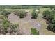 Aerial showcasing potential building land with scattered trees and an open field, creating peaceful setting at 8337 Fussell Rd, Polk City, FL 33868