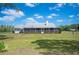 Large back yard featuring screened-in porch perfect for entertaining at 8337 Fussell Rd, Polk City, FL 33868
