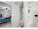 Ensuite bathroom features tile floors, standard toilet, and walk-in shower with storage at 8337 Fussell Rd, Polk City, FL 33868