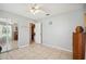 Bedroom featuring a mirror closet, ceiling fan, and neutral-toned walls at 8337 Fussell Rd, Polk City, FL 33868