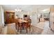 A traditional dining room with vaulted ceilings and an ornate chandelier at 8337 Fussell Rd, Polk City, FL 33868