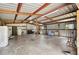 Spacious garage space with high ceilings and exposed beams at 8337 Fussell Rd, Polk City, FL 33868