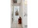 Bright hallway with tile floors leading to a bathroom and bedroom at 8337 Fussell Rd, Polk City, FL 33868