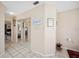 Hallway featuring a mirror closet and tile flooring at 8337 Fussell Rd, Polk City, FL 33868