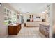 Spacious kitchen with tile floors, bright lighting, and ample cabinet and counter space at 8337 Fussell Rd, Polk City, FL 33868
