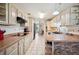 Bright kitchen with neutral cabinets, tile floors, and open layout at 8337 Fussell Rd, Polk City, FL 33868