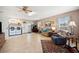 Spacious living room with laundry area, furnishings, and tile floors at 8337 Fussell Rd, Polk City, FL 33868