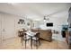 Open living room with neutral paint, tile floors, dining area and comfortable furniture at 8337 Fussell Rd, Polk City, FL 33868