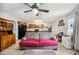 View of an open-concept living room featuring comfortable seating and kitchen at 8337 Fussell Rd, Polk City, FL 33868