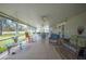 Outdoor patio with multiple ceiling fans, furnishings, and tile flooring at 8337 Fussell Rd, Polk City, FL 33868