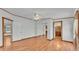 Bedroom with wood floors, closet and an ensuite bathroom at 8341 Mitchall Dr, Lakeland, FL 33809