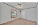 Bedroom featuring a ceiling fan, a window, carpet and neutral walls at 8341 Mitchall Dr, Lakeland, FL 33809