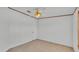 Bedroom features neutral carpet, fan, and closet at 8341 Mitchall Dr, Lakeland, FL 33809