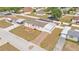 An aerial view shows a house with a long driveway and a white porch at 8341 Mitchall Dr, Lakeland, FL 33809