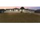 Charming home with a welcoming front porch and a well-maintained lawn at 8341 Mitchall Dr, Lakeland, FL 33809
