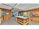 Spacious garage featuring a workbench, ample storage, and easy access to home essentials at 8341 Mitchall Dr, Lakeland, FL 33809
