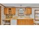 Kitchen offers wood cabinets, laminate counters, a dishwasher, and a desk space at 8341 Mitchall Dr, Lakeland, FL 33809