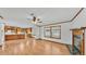 Combined living and kitchen area with hardwood floors and a cozy fireplace at 8341 Mitchall Dr, Lakeland, FL 33809
