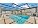 Spacious, covered pool area featuring ramp access and a sunny disposition, great for relaxation at 8341 Mitchall Dr, Lakeland, FL 33809