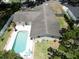 Aerial view of a home with a refreshing pool and well-maintained yard space at 1503 Clairdale Ln, Lakeland, FL 33801