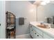 Bathroom featuring a sink with a vanity, a mirror, and a rack for storage at 1503 Clairdale Ln, Lakeland, FL 33801