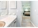 Bathroom vanity with a view into the bedroom at 1503 Clairdale Ln, Lakeland, FL 33801