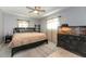 Comfortable bedroom featuring a ceiling fan and neutral decor with natural light at 1503 Clairdale Ln, Lakeland, FL 33801