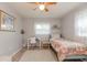 Bedroom featuring a bed, a desk, and a window at 1503 Clairdale Ln, Lakeland, FL 33801