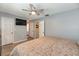 Bedroom showcasing a ceiling fan, and easy access to the bathroom at 1503 Clairdale Ln, Lakeland, FL 33801